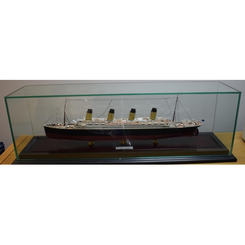 210 - Hand made model of the White Star Line passenger liner Titanic. Detailed scale model housed in a gla... 