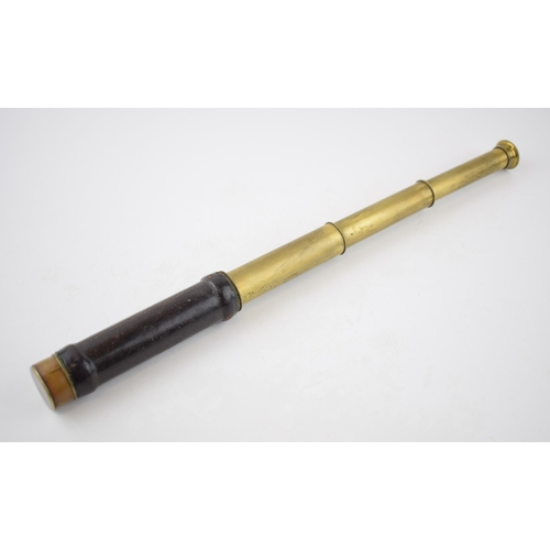 211 - Pocket-sized brass telescope with leather grip. Brass cover to eye-piece. Inscribed 'Charles Pearson... 