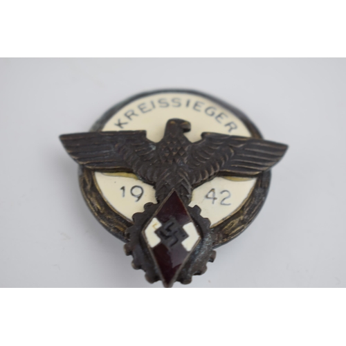 219 - A collection of German military items to include a ring with skull and crossbones marked D.G.R.M and... 