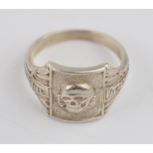 219 - A collection of German military items to include a ring with skull and crossbones marked D.G.R.M and... 