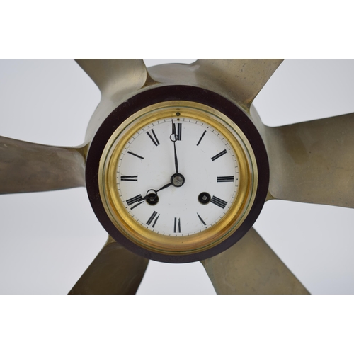 230 - Phosphor bronze propellor with pendulum chiming clock. White ceramic dial with Roman numerals and be... 