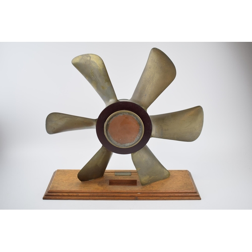 230 - Phosphor bronze propellor with pendulum chiming clock. White ceramic dial with Roman numerals and be... 