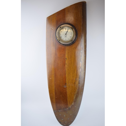 231 - WWII Propellor tip with brass edging with Smiths P H 23,481 clock. Wall mountable. Length 76cm, widt... 