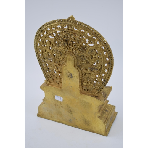 234 - Large reproduction Tibetan gilt bronze figure of a seated Tibetan buddha on a throne, 28cm tall.