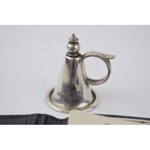 236 - Concorde Interest: an original silver plated candle snuffer, engraved 'Concorde', together with a Co... 