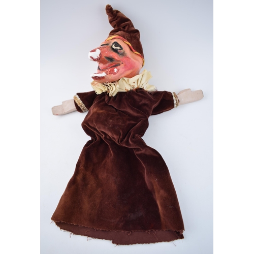 249 - An early 20th century naive plaster hand puppet in the form of Mr Punch in velvet dress with wooden ... 