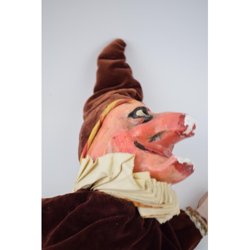 249 - An early 20th century naive plaster hand puppet in the form of Mr Punch in velvet dress with wooden ... 