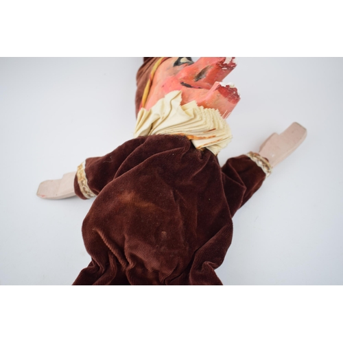 249 - An early 20th century naive plaster hand puppet in the form of Mr Punch in velvet dress with wooden ... 