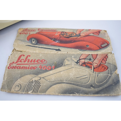 251 - Boxed Schuco Examico 4001 tin toy clockwork car. With four working gears and reverse. Original Schuc... 