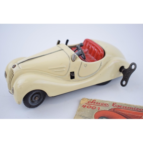 251 - Boxed Schuco Examico 4001 tin toy clockwork car. With four working gears and reverse. Original Schuc... 