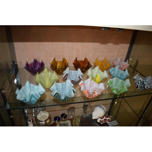 258 - A collection of Chance Pilkington Handkercheif glass vases in varying colours, some with original go... 