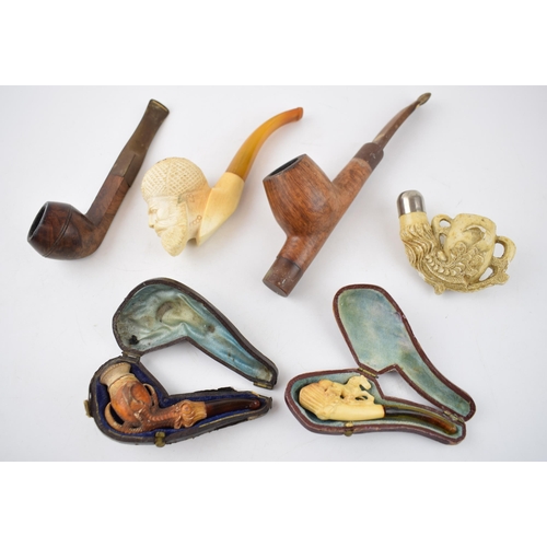 267 - Smoking Interest: a collection of smoking pipes to include a cased meerschaum example, another simil... 