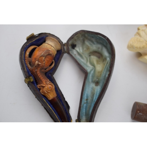 267 - Smoking Interest: a collection of smoking pipes to include a cased meerschaum example, another simil... 