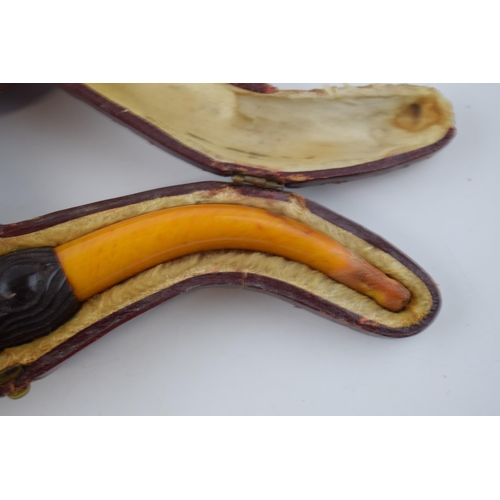 268 - Cased early 20th century meerschaum smoking pipe in the form of a ball and claw with amber handle, i... 