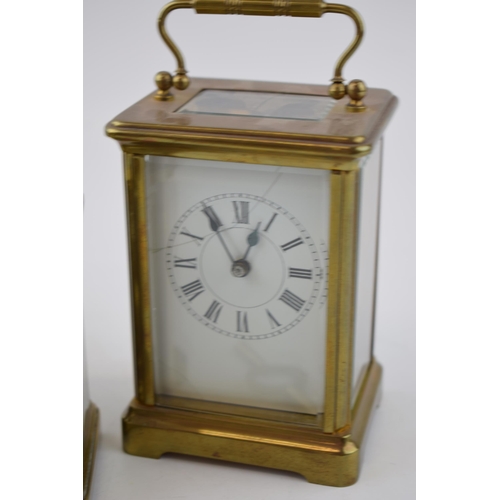 284 - A trio of early 20th century French brass carriage clocks, each with bevelled glass, all unnamed, 2 ... 