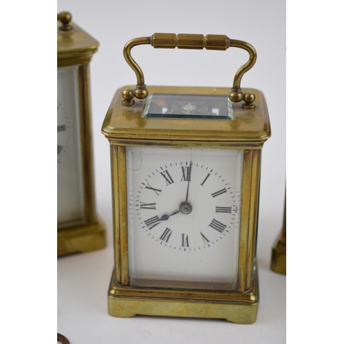 284 - A trio of early 20th century French brass carriage clocks, each with bevelled glass, all unnamed, 2 ... 