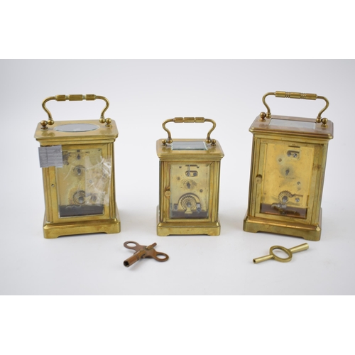 284 - A trio of early 20th century French brass carriage clocks, each with bevelled glass, all unnamed, 2 ... 