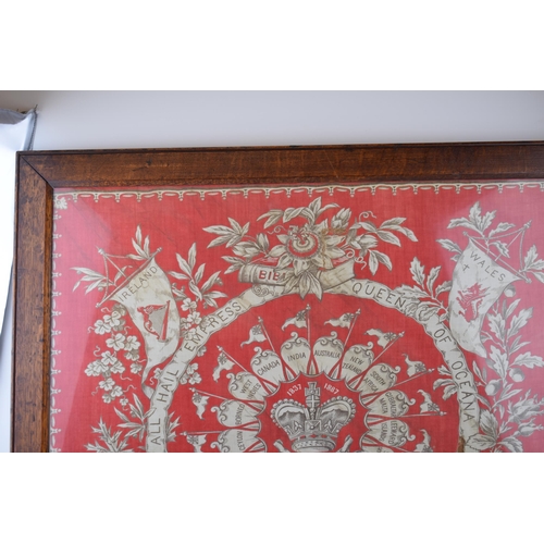 335 - A framed commemorative cloth celebrating Queen Victoria's Golden Jubilee. Victoria crown to centre w... 