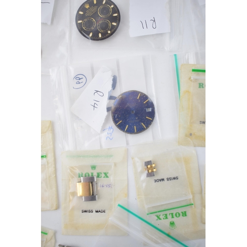 364 - A good collection of Rolex watch parts and similar to include dials, movement parts, balances, gold ... 