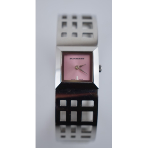 385 - A ladies Burbury's fashion watch with Swiss quartz movement. Pink square dial with applied baton mar... 