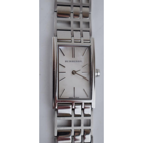 386 - A ladies Burbury's fashion watch with Swiss quartz movement. Mother of pearl effect rectangular dial... 