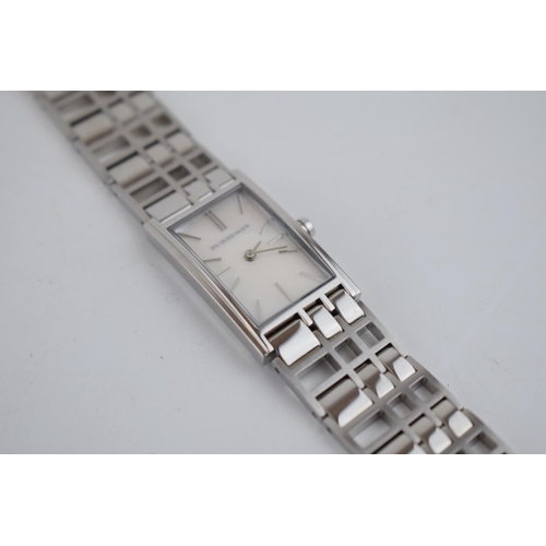 386 - A ladies Burbury's fashion watch with Swiss quartz movement. Mother of pearl effect rectangular dial... 