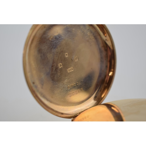 388 - 9ct gold cased open face top wind pocket watch, John Elkan Ltd London, 'Colonial', in working order,... 