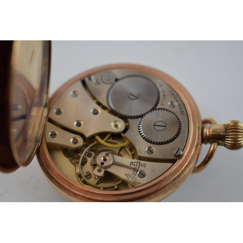 388 - 9ct gold cased open face top wind pocket watch, John Elkan Ltd London, 'Colonial', in working order,... 