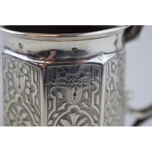 414 - Victorian hallmarked silver tankard with engraved decoration, 9.5cm tall, 124.0 grams.