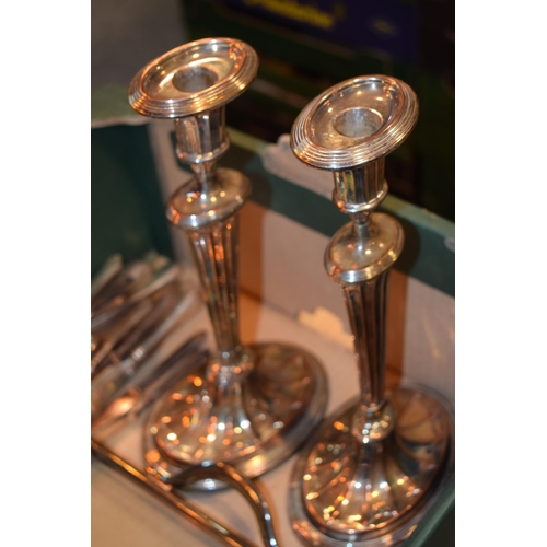 422 - A pair of Edwardian silver-plated candle sticks in a classical style. Height 31cm. A continental ant... 