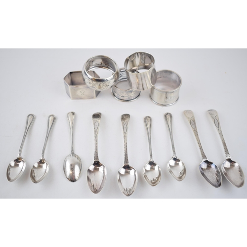 424 - A collection of sterling silver items to include 5 singular napkin rings with tea spoons, combined w... 