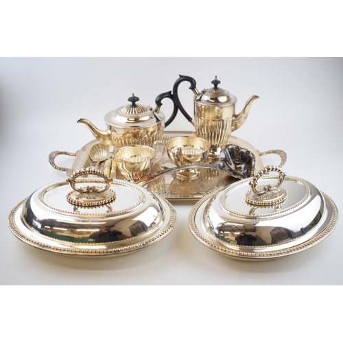 425 - Silver plate to include a pair of entree dishes, a 4 piece teaset, a large tray and others.