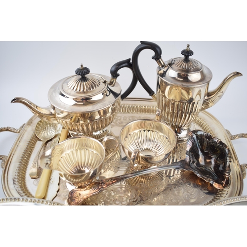 425 - Silver plate to include a pair of entree dishes, a 4 piece teaset, a large tray and others.