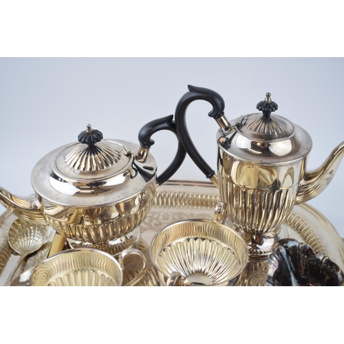 425 - Silver plate to include a pair of entree dishes, a 4 piece teaset, a large tray and others.