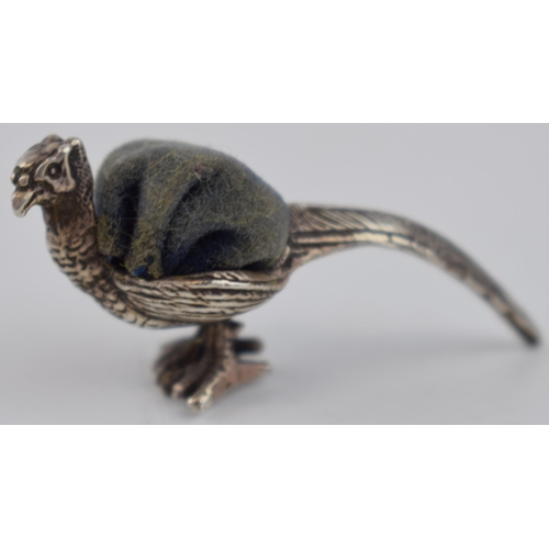 426 - Early 20th century sterling silver pin cushion in the form of a pheasant with blue velvet cushion, 4... 