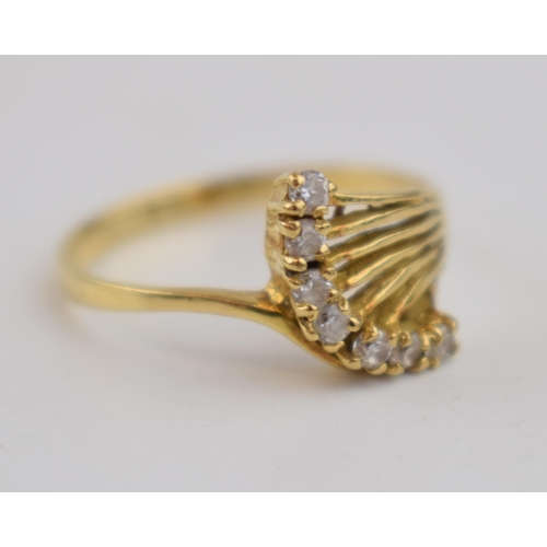 456 - 18ct gold ring with CZs and ornate shoulder in the form of a bouquet of flowers, 2.5 grams, size Q.