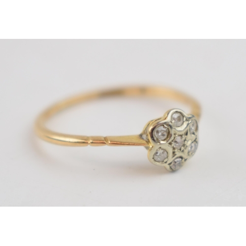 467 - 18ct gold diamond daisy ring, 1.5 grams, Chester 1910, size O.