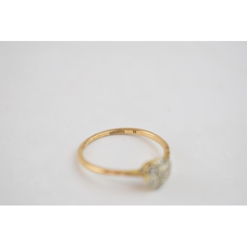 467 - 18ct gold diamond daisy ring, 1.5 grams, Chester 1910, size O.