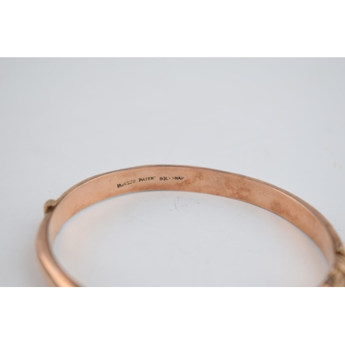 480 - 9ct rose gold hollow bangle with engraved decoration, 8.7 grams.