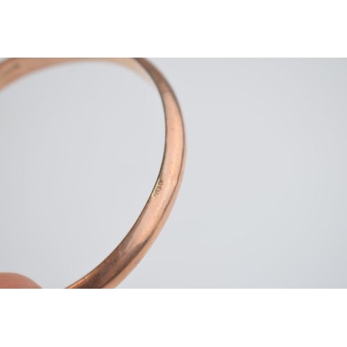 480 - 9ct rose gold hollow bangle with engraved decoration, 8.7 grams.