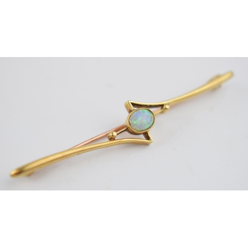 482 - 15ct gold bar brooch set with central opal, 3.8 grams, 64mm.