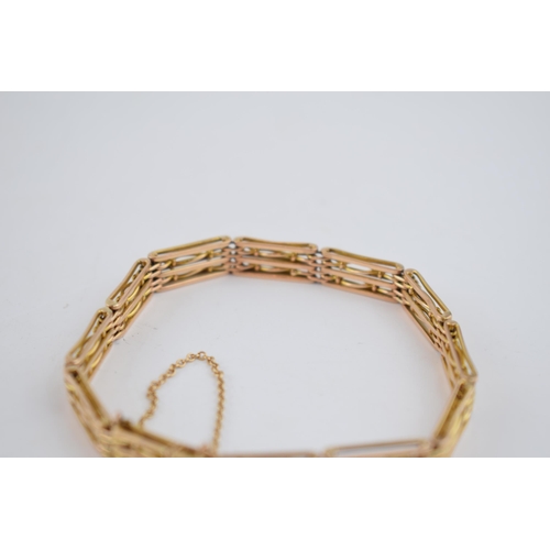 483 - 9ct gold early 20th century gate bracelet, 12.9 grams, with safety chain.