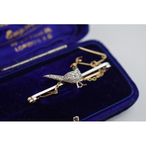 492 - 15ct gold bar brooch with a pheasant, set with old cut diamonds, enamelled decoration, with safety c... 