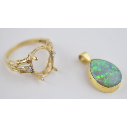 495 - A 9ct gold pendant with opal-style insert together with a 9ct gold ring setting, combined 4.8 grams ... 