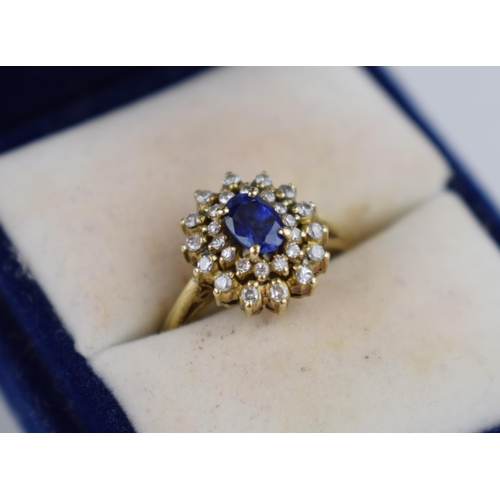 500 - 14ct yellow gold sapphire and diamond cluster ring marked .585 to shank. Center oval Ceylon sapphire... 