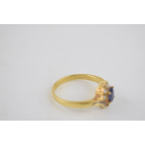 501 - 18ct yellow gold sapphire and diamond oval cluster ring. 3 Diamonds each side with an additional 6 d... 