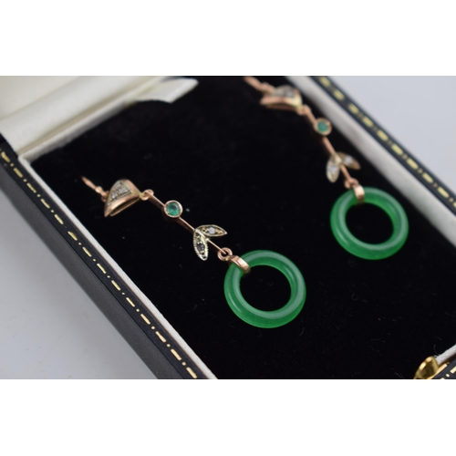 515 - 9ct gold drop earrings with circular jade rings with rose cut diamonds, 5cm long.