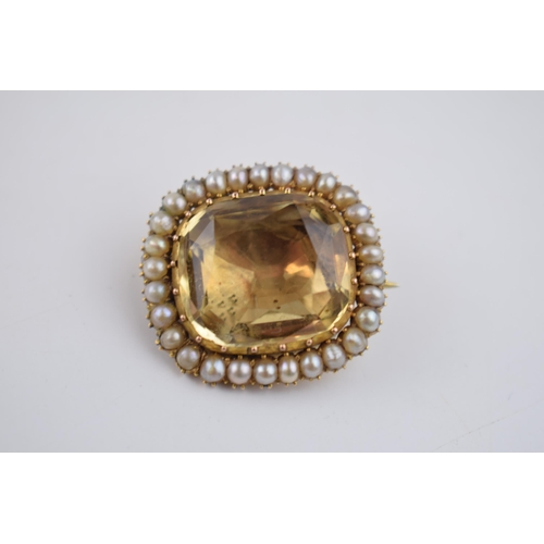 518 - Georgian high carat foil back brooch set with yellow topaz and pearls, 26mm wide, 7.5 grams.