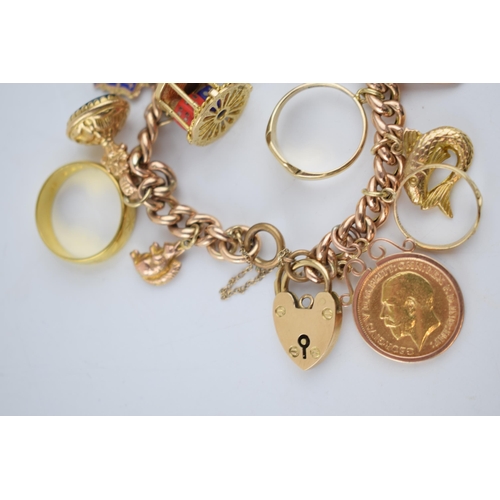 523 - 9ct rose gold charm bracelet with an interesting collection of charms to include a 22ct gold 1912 ha... 