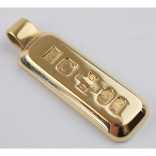 526 - 9ct gold ingot, full hallmarks to front, 4cm tall, 16.6 grams.